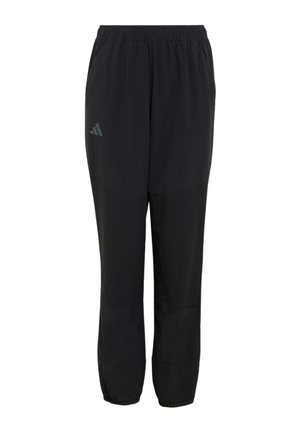 Pantalon de sport noir avec taille et poignets élastiques, présentant un logo discret sur la partie supérieure de la cuisse gauche.