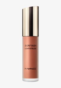 MAC Skinfinish Lightstruck flydende highlighter med frostet glasflaske og skinnende guldhætte.