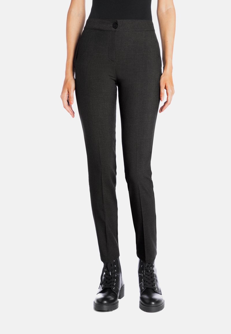 Black tailored pants with a fitted design, flat front, and button closure, made of textured fabric; paired with black lace-up boots.