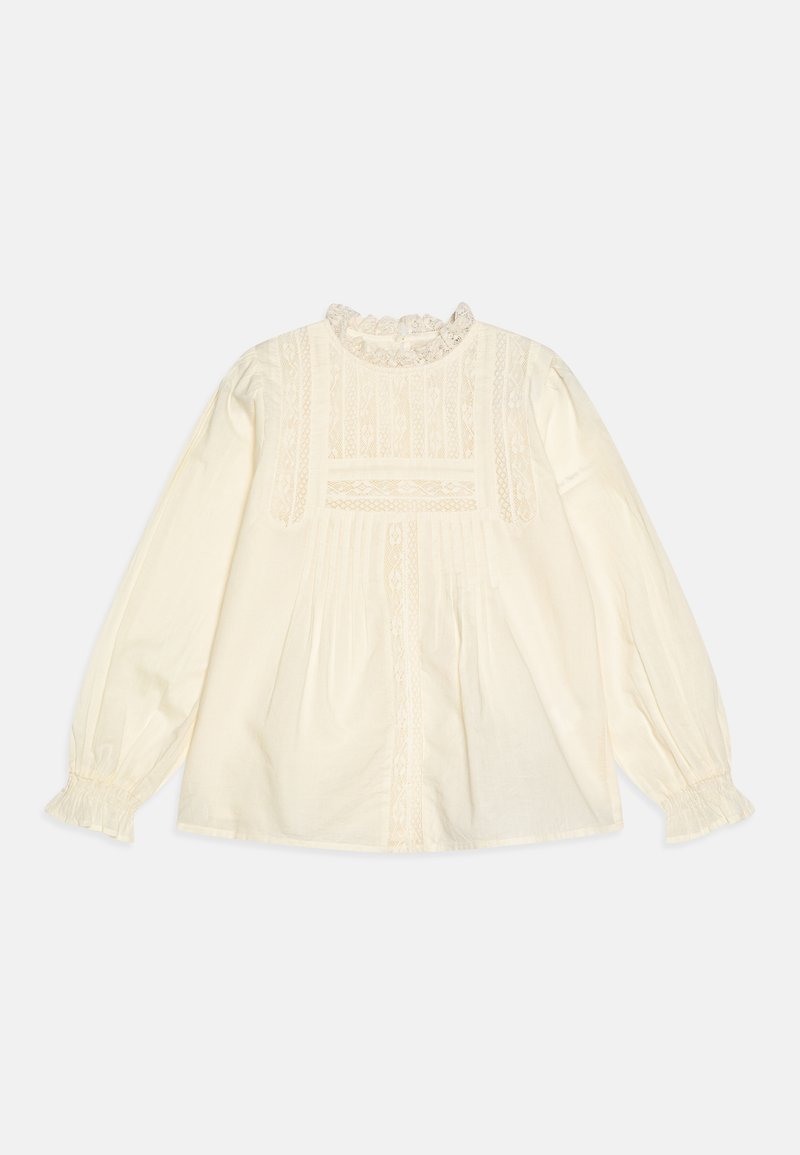 Blusa color crema con maniche lunghe, dettagli in pizzo, plissee e scollatura arricciata. Presenta una vestibilità morbida e una texture del tessuto delicata.