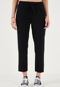 REGULAR FIT - Hlače - black