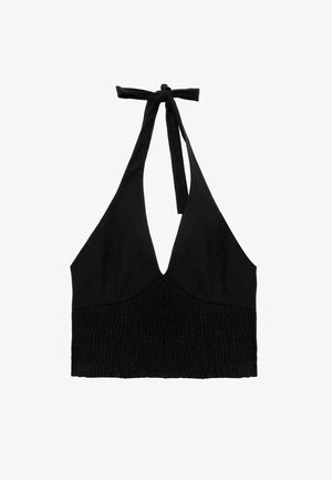 Black halter crop top made of textured fabric, featuring a deep V-neck and gathered detailing at the bodice, tied at the neck.