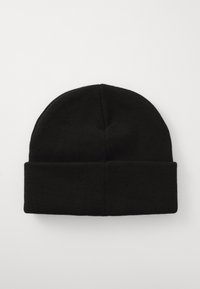 Black knitted beanie hat with folded cuff, laid flat on a white surface.