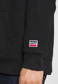 Levi's® RELAXED GRAPHIC - Sweatshirt com capuz - black