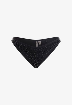 Zwarte bikini onderkant met een driehoekige snit, met decoratieve zwarte oogjes aan één kant. Het materiaal lijkt glad en elastisch. Maatlabel zichtbaar.