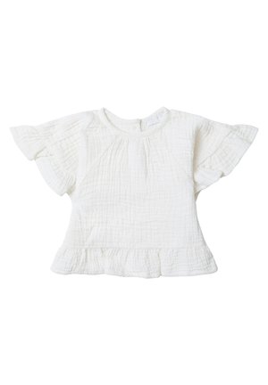 Haut blanc à manches courtes avec un ourlet volants, fabriqué en tissu texturé. Présente un col rond et des détails plissés à l'avant.