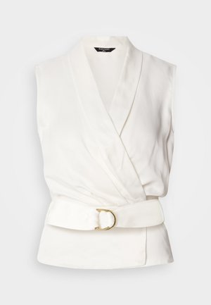 Sleeveless white blouse with a wrap design and a belted waist. Features a smooth texture and a gold circular buckle accent.