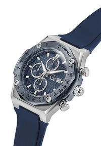 Jūras spēku gumijas siksniņu pulkstenis ar sudraba nerūsējošā tērauda korpusu, strukturētu zilu ciparnīcu, trim subciparnīcām un takimetru skalā uz rāmja.