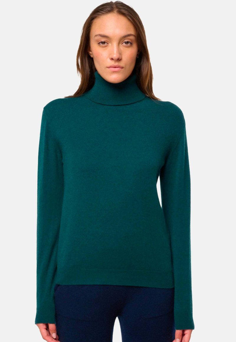 Türkiser Rollkragenpullover mit langen Ärmeln, aus weichem Stoff, mit lockerer Passform und gerippten Bündchen und Saum.