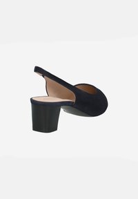 Navy blue suede slingback shoe with a rounded toe, a chunky black heel, and an open side revealing the interior.