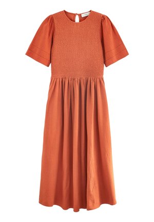 Rust-colored midi dress with smocked bodice, short puff sleeves, gathered skirt, and round neckline with back button closure.