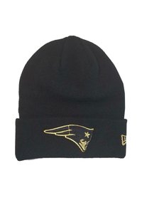 Black knit beanie with a cuff. Features an embroidered gold New England Patriots logo on the front. Soft texture, snug fit.