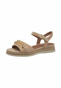 Beige Wildledersandale mit einem breiten Riemen, der dekorative klare Akzente aufweist. Leicht gepolsterte Sohle und verstellbarer Knöchelriemen für einen sicheren Sitz.