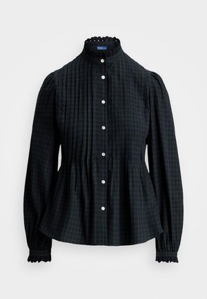 Blusa tartan verde scuro con collo alto, chiusura a bottoni e maniche puff arricciate. Presenta un tessuto testurizzato e dettagli in pizzo ai polsini.