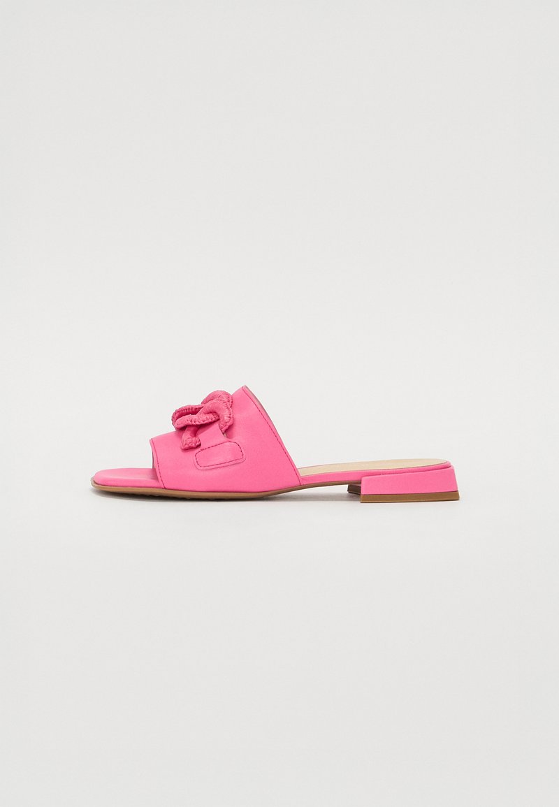 Pink slide sandal featuring a knotted accent, open toe design, low block heel, and smooth synthetic material.