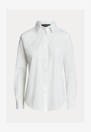 Fehér, hosszú ujjú, gombos ing hegyes gallérral, elöl gombokkal és enyhén ívelt szegéllyel.