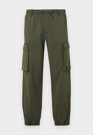 Olive-green cargo pants made of lightweight fabric. Elastic waistband with drawstring, two side pockets, and two cargo pockets on thighs.