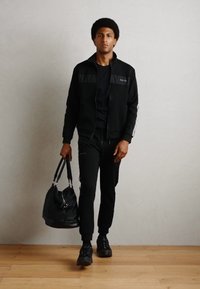 Antony Morato TROUSERS METAL EFFECT RUBBER LOGO - Pantalon de survêtement - black