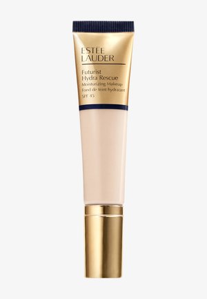 Estée Lauder Futurist Hydra Rescue Tube, beige mit goldenen und marineblauen Akzenten, enthält feuchtigkeitsspendendes Make-up mit LSF 45, zeichnet sich durch eine glatte Textur aus.