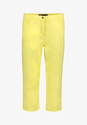 Pantalon jaune taille mi-haute, coupe slim, avec fermeture à boutons et glissière à l’avant, passants pour ceinture, poches avant, longueur raccourcie.