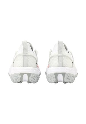 Pair of white athletic shoes shown from the back with textured gray soles and pull tabs on the heel collars.
