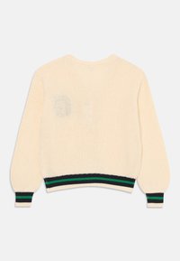 Stickad tröja i krämfärg med en kort design. Har ribbade mudd och fåll i svart med gröna ränder. Texturerad, andningsbar tyg.