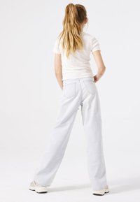 Lichtblauwe wijde jeans van denim, met een hoge taille, twee achterzakken en een subtiel vervaagde afwerking.