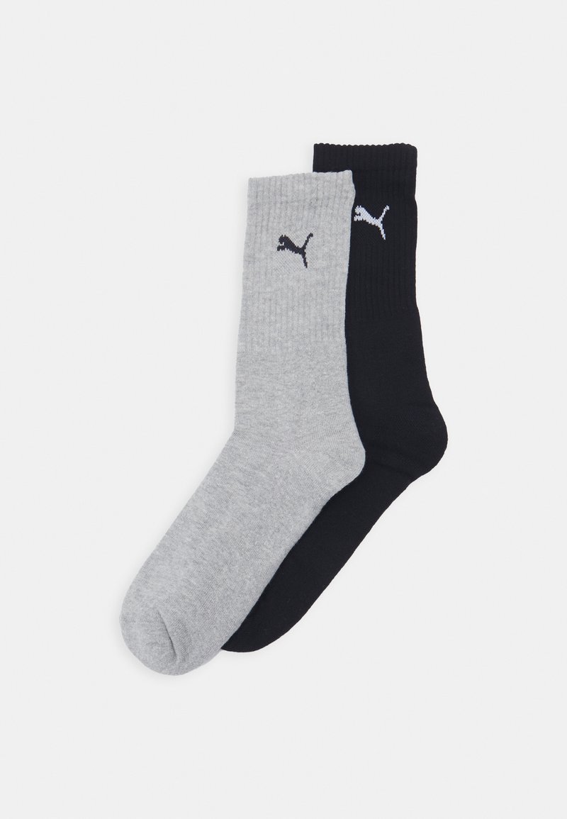 Kaks paari soonikuga linasid: üks helesinine ja üks must, kummalgi ülaosas väikese valge Puma logosid.