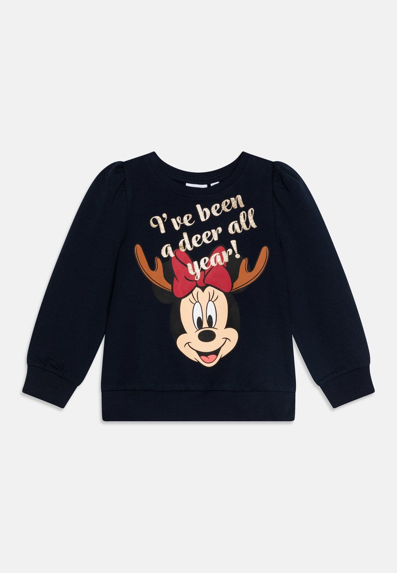 Tumesinine dressipluus pikade varrukatega, elastsete mansettidega, millel on koomiksitegelane sarvedega ja punase lipsuga. Tekst ütleb: "Olen olnud kogu aasta jäär!"