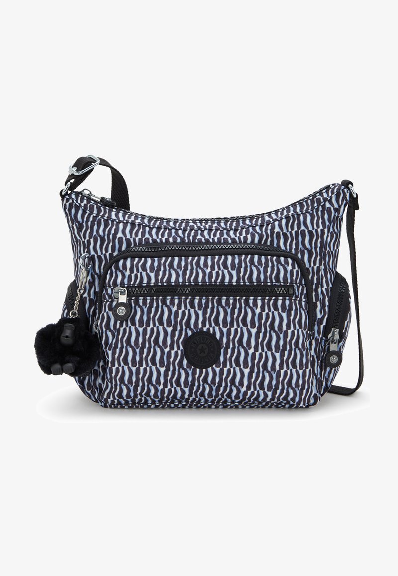 Torebka typu crossbody w niebiesko-czarne paski zebry, wykonana z materiału, z wieloma kieszeniami zamykanymi na zamek i dodatkiem w postaci pom-pom. Teksturowane wykończenie.