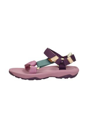 Sandalia deportiva con suela de goma rosa, correas de nailon multicolores en púrpura, verde y crema, que presenta hebillas ajustables seguras.