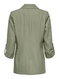 Blazer femme vert clair à manches trois-quarts retroussées et fente arrière, vu de dos sur fond blanc.