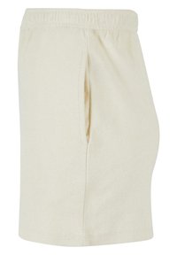 Pantalones cortos de algodón beige con cinturilla elástica, bolsillos laterales y un acabado suave y texturizado. Presenta un corte recto y dobladillo.