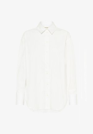 Hvid skjorte med knapper i glat stof, der har en klassisk krave, lange ærmer og en buet kant. Subtil knapdetalje foran.