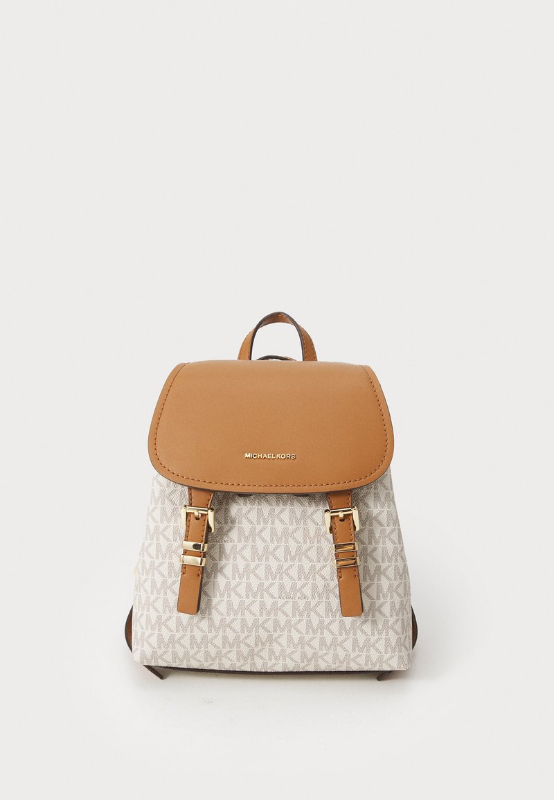Backpack features a tan leather flap and straps, gray fabric body with repeating MK logo pattern, gold-tone hardware, and sturdy design.