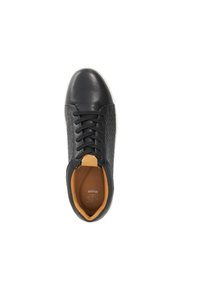 Black leather sneaker with quilted side panels, round toe, lace-up design, contrasting tan inner lining, and white rubber sole.