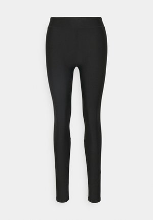 Schwarze Leggings aus dehnbarem Material, mit hohem Bund, figurbetontem Schnitt und nahtlosem Design.