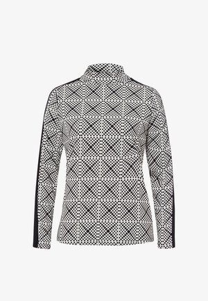 Langemouwig, hooggesloten shirt met zwart-wit geometrisch stippenpatroon en effen zwarte strepen die langs de mouwen lopen.