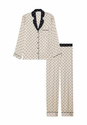 Beige pyjama-set met polka dotjes en zwarte accenten. Het langermouwen shirt heeft een kraag en een zak; de broek heeft een elastische tailleband.