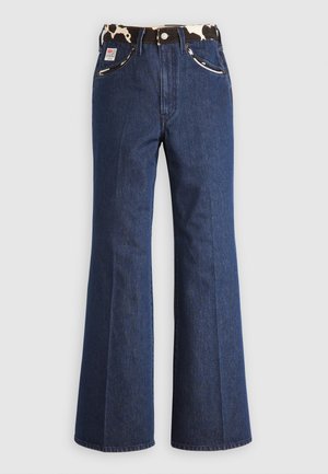 Uitlopende denim jeans in donkerblauw, met een gebloemd tailleband en zilveren accenten, voorzien van twee voorzakken en een standaard ritssluiting.