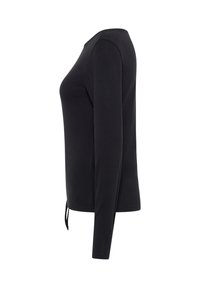 Top à manches longues noir avec un col rond, fabriqué en tissu lisse, présentant un détail noué à la taille et une silhouette ajustée.