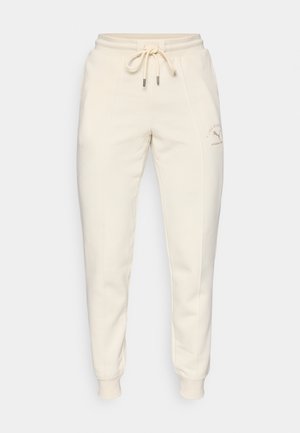 Cremfarbene Sweatpants aus weichem Stoff, ausgestattet mit einem elastischen Bund mit Kordelzug und gerippten Bündchen. Mit dezentem Logo-Detail.