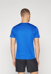ASICS CORE TOP - Sports T-shirts - blue
