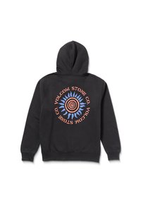 Haut à capuche noir avec un graphique circulaire central comportant des cercles concentriques et des rayons de soleil en bleu et orange. Tissu doux, capuche ajustable.