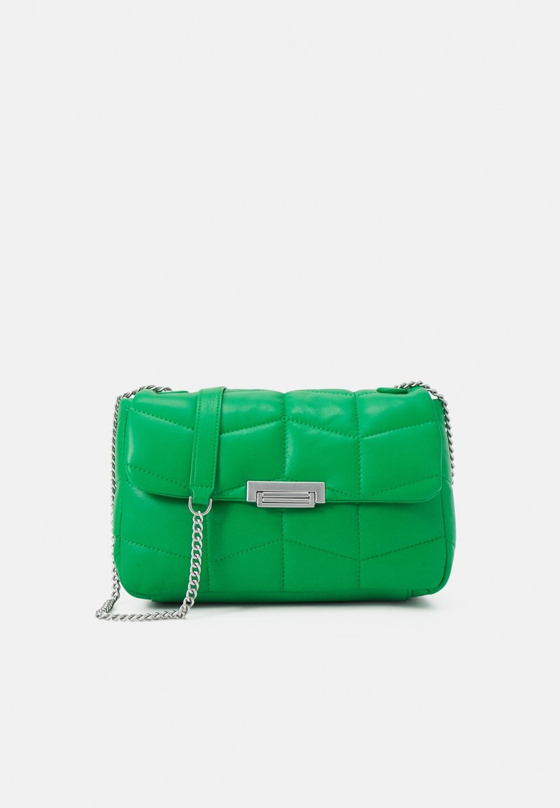 Green quilted crossbody bag made of leather with a textured surface. Features a silver chain strap and a rectangular clasp on the front.