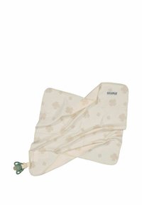 Beige tygfilt med ett subtilt blommönster, med en mjuk textur och en hörndetalj med en grön napp.