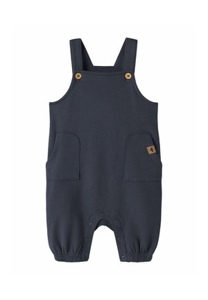 Barboteuse bébé bleu marine sans manches avec bretelles ajustables, poches avant et boutons-pression à l'entrejambe et aux poignets des chevilles.