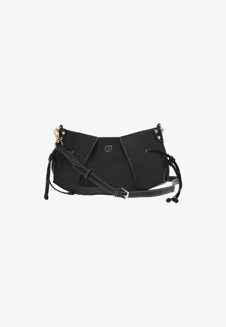 Sac à main en cuir noir avec quincaillerie dorée, présentant un design structuré, des coutures blanches contrastantes et une bandoulière amovible.