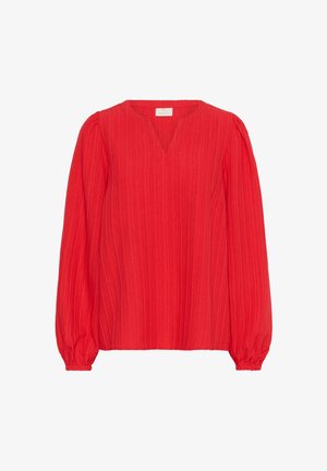 Červená blúzka s dlhými rukávmi z textúrovanej látky s výstrihom do V a gumenými balónovými rukávmi. Obsahuje vertikálne pruhy po celej ploche materiálu.