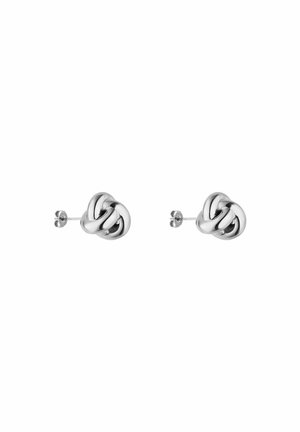 Boucles d'oreilles en argent en forme de nœud avec une surface lisse et réfléchissante. Présentent un design torsadé ajoutant de la profondeur et de la texture.
